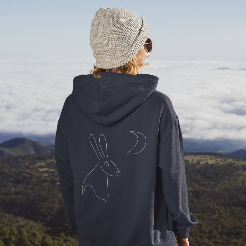 White Hare Stares at Moon | Sustainable Hoodie worn by a woman
