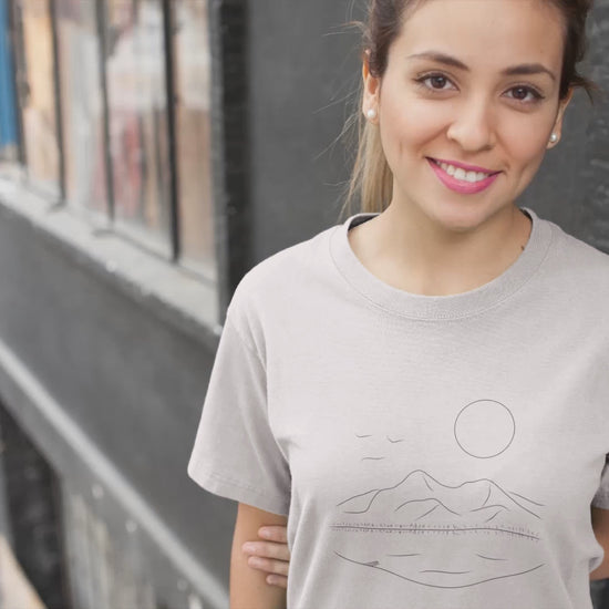 Mountain Serenity | 100% Organic Cotton T Shirt worn by a woman on the street