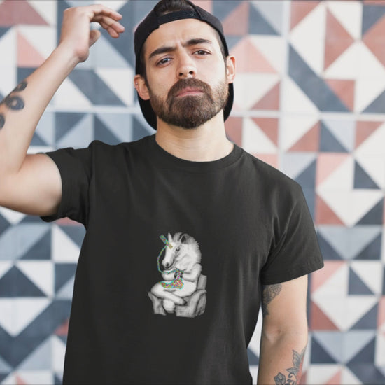 Knitting Unicorn | 100% Organic Cotton T Shirt  worn by a man by a wall