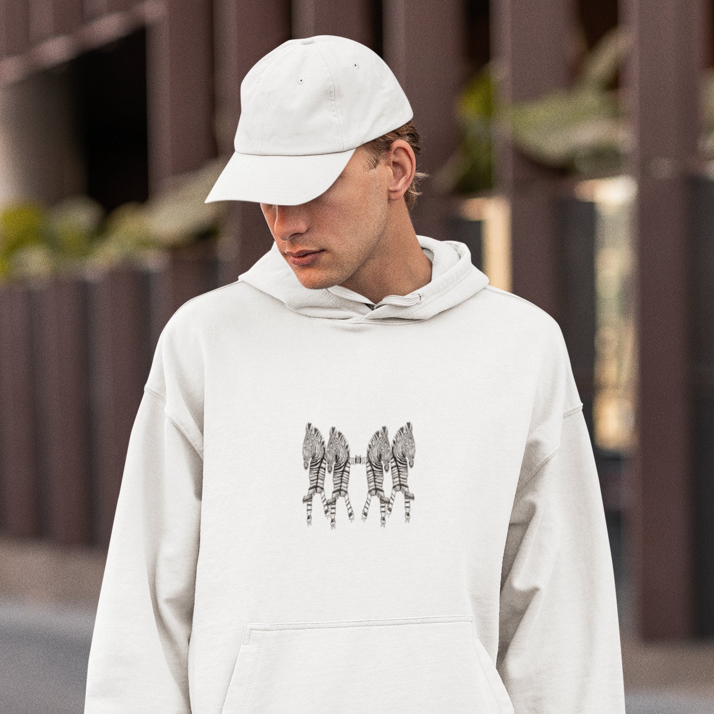 Roller Skating Zebras | Sustainable Hoodie worn by a man