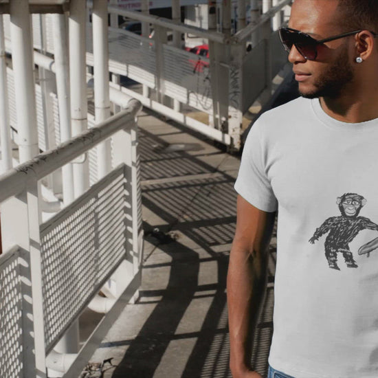Chimp with a Skateboard | 100% Organic Cotton T Shirt worn by a man