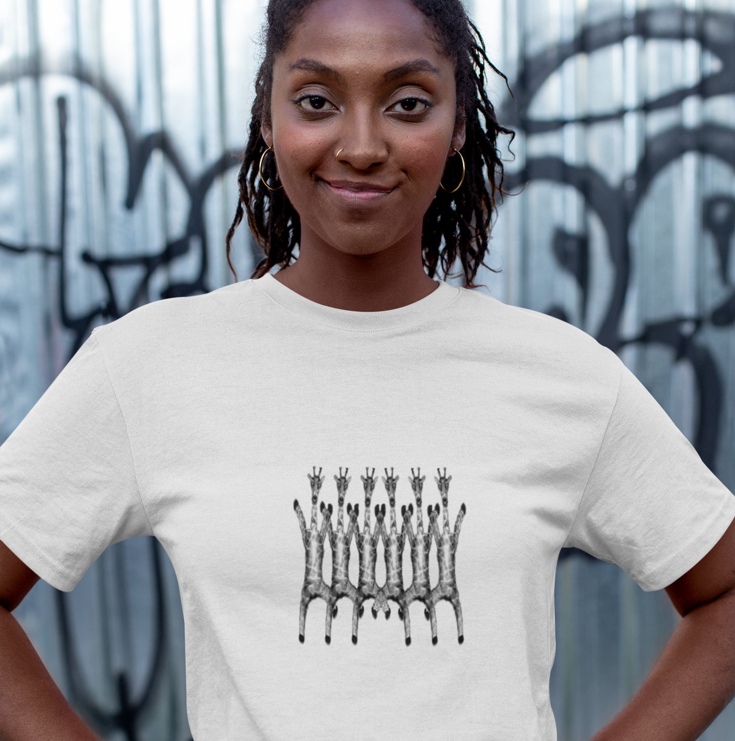 Dancing Giraffes | 100% Organic Cotton T Shirt in white worn by a woman