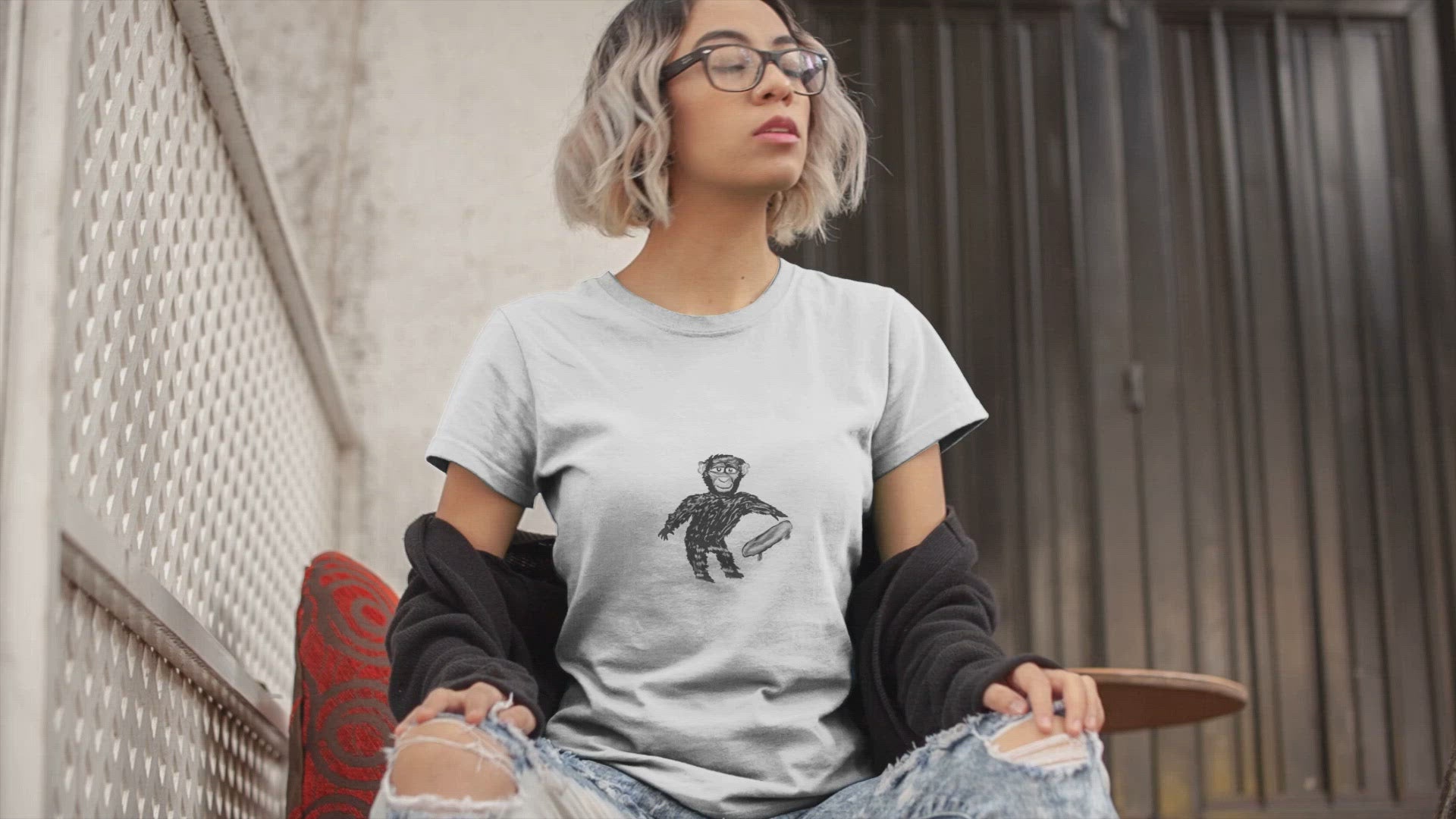 Monkey Skateboard | 100% Organic Cotton T Shirt worn by a woman sat outside