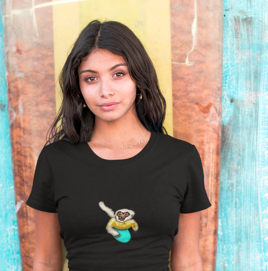 Gibbon Surfing | 100% Organic Cotton T Shirt worn by woman in front of surf board