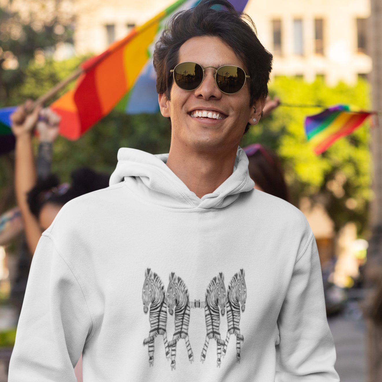 Man wearing a Rollerskating zebras sustainable vegan hoodie