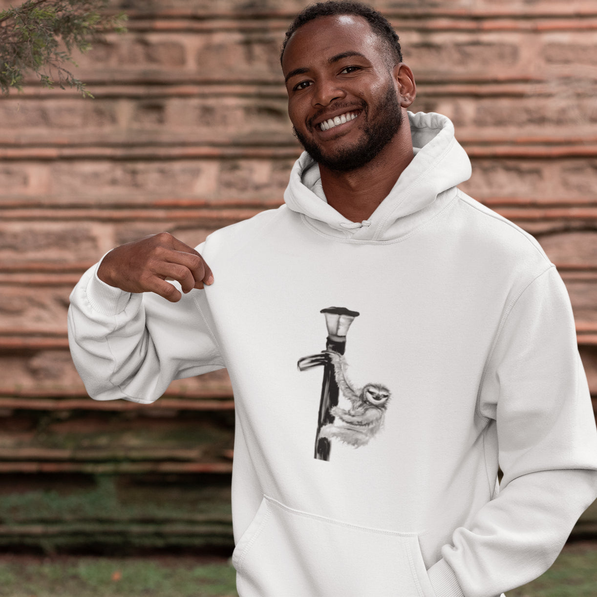 Man wearing a Sloth on a lamp post sustainable vegan hoodie