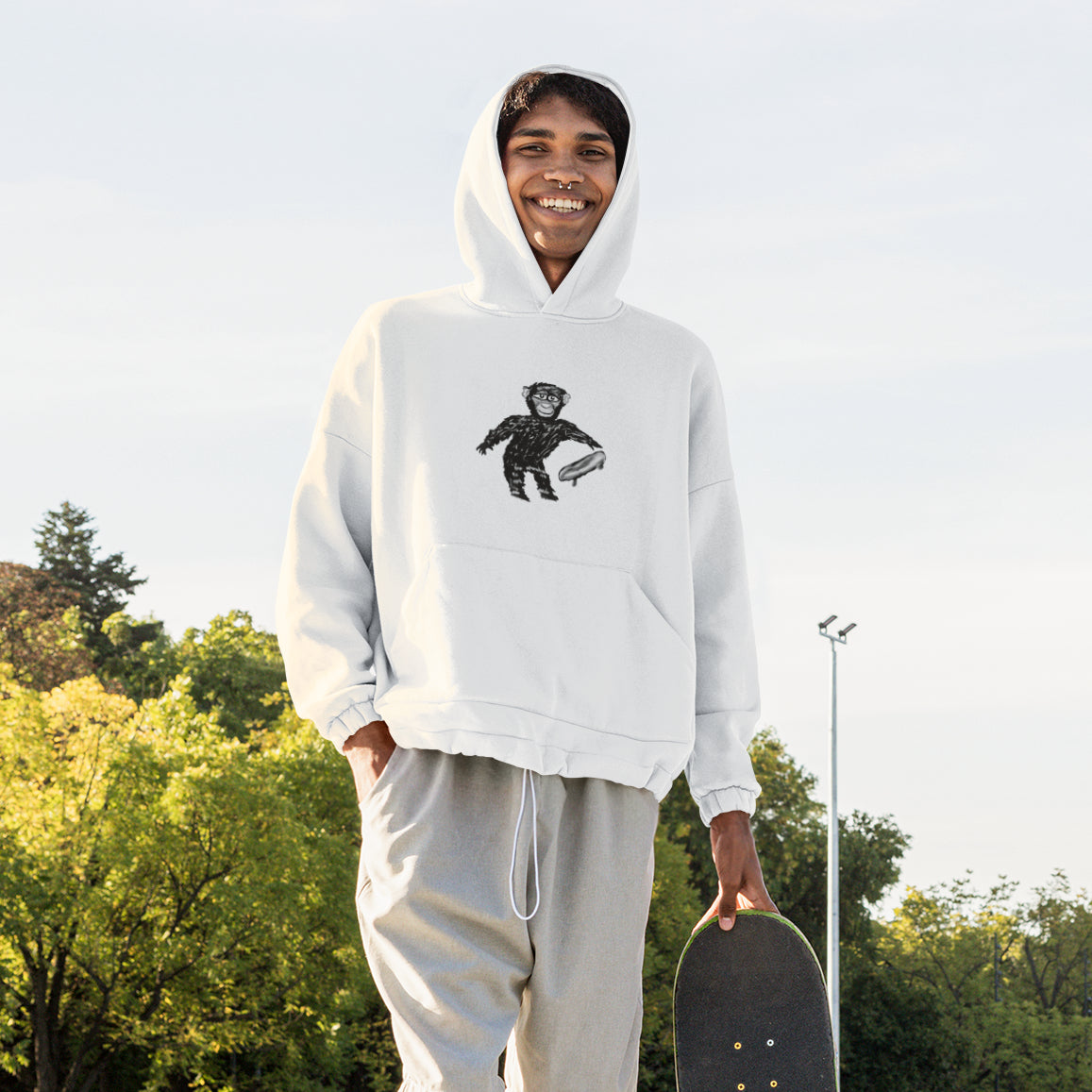 Monkey Skateboarding | Sustainable Hoodie One Pouch worn by a man