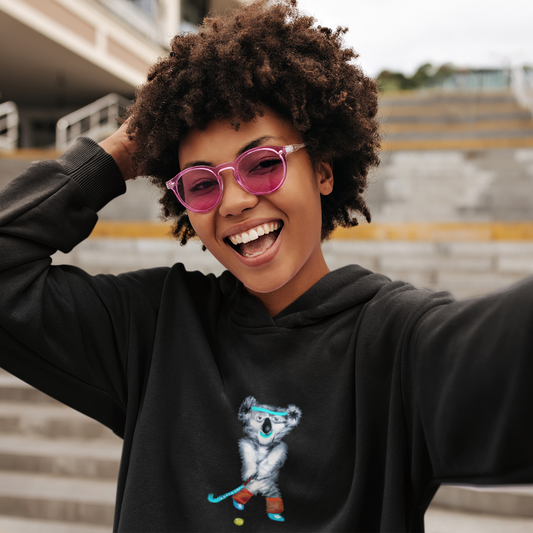 Koala Playing Hockey | Sustainable Hoodie worn by a woman smiling