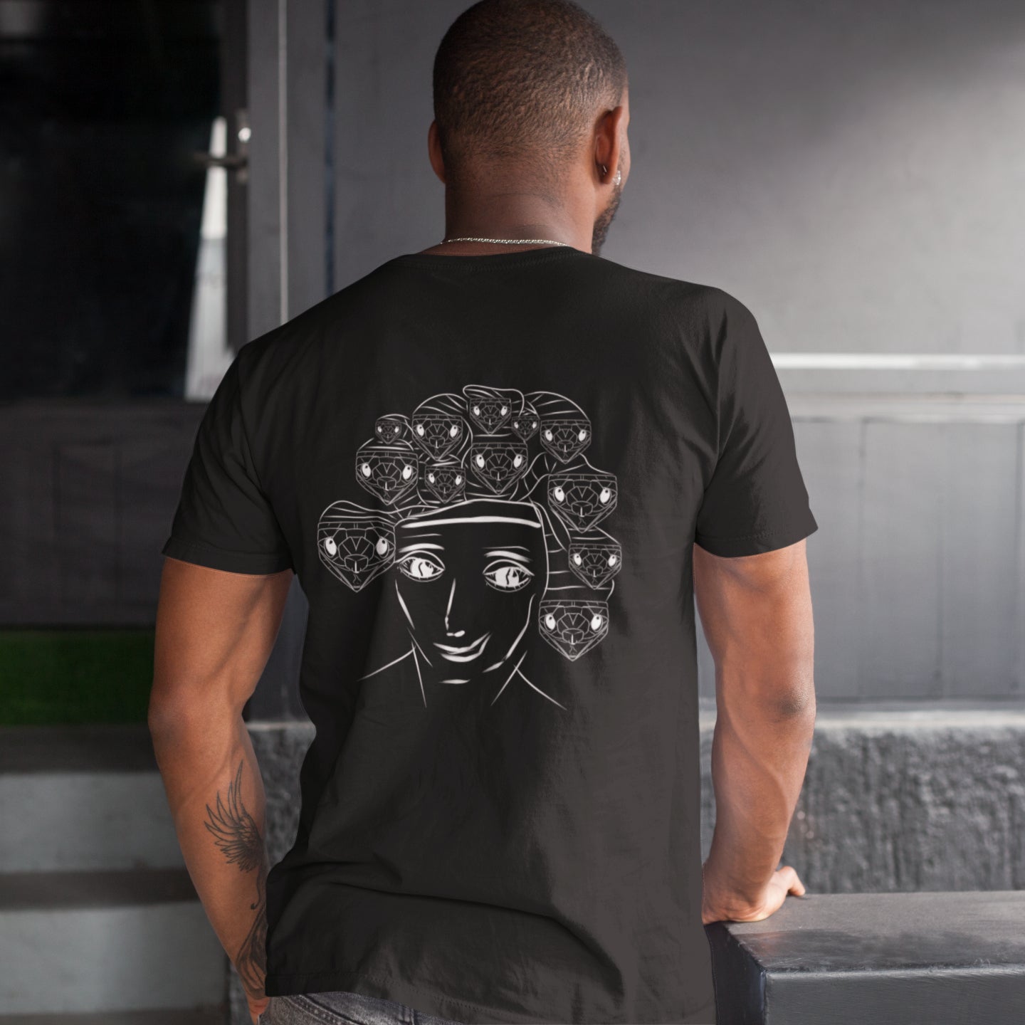 White Medusa | 100% Organic Cotton T Shirt worn by a man in black back view