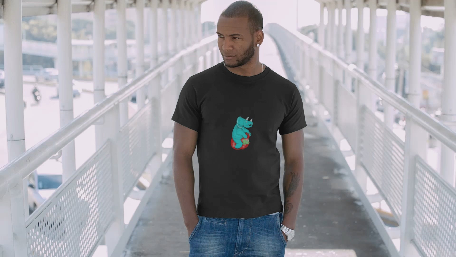 Dinosaur Space Hopper | 100% Organic Cotton T Shirt worn by a man on a bridge