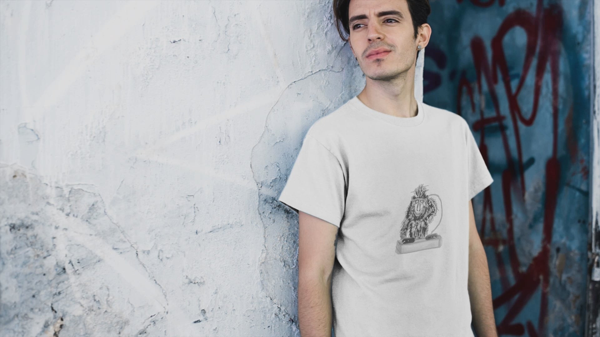 Monkey DJ | 100% Organic Cotton T Shirt worn by a man by a wall