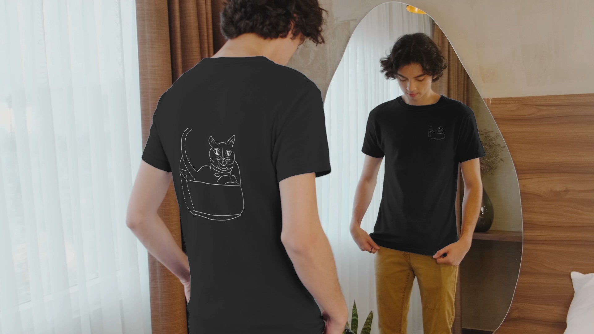 Cat white | 100% Organic Cotton T Shirt worn by a man looking in the mirror