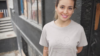 Mountain Serenity | 100% Organic Cotton T Shirt worn by a woman on the street