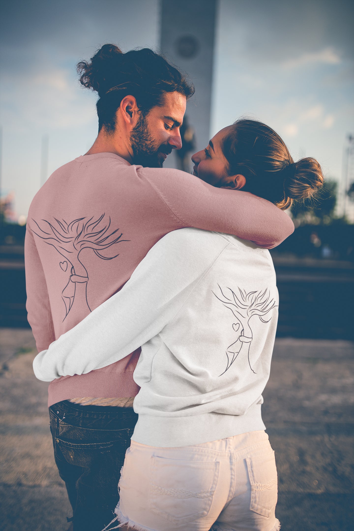 Man and woman wearing a sustainable jumper