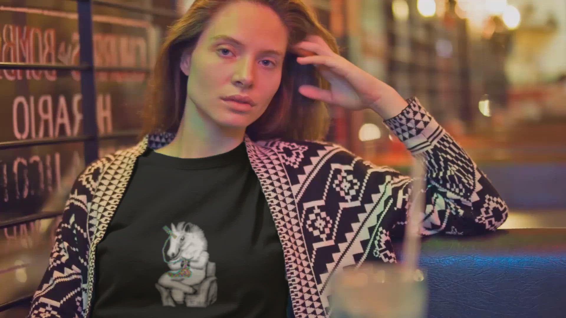 Knitting Unicorn | Women's 100% Organic Cotton T Shirt worn by a woman in a bar