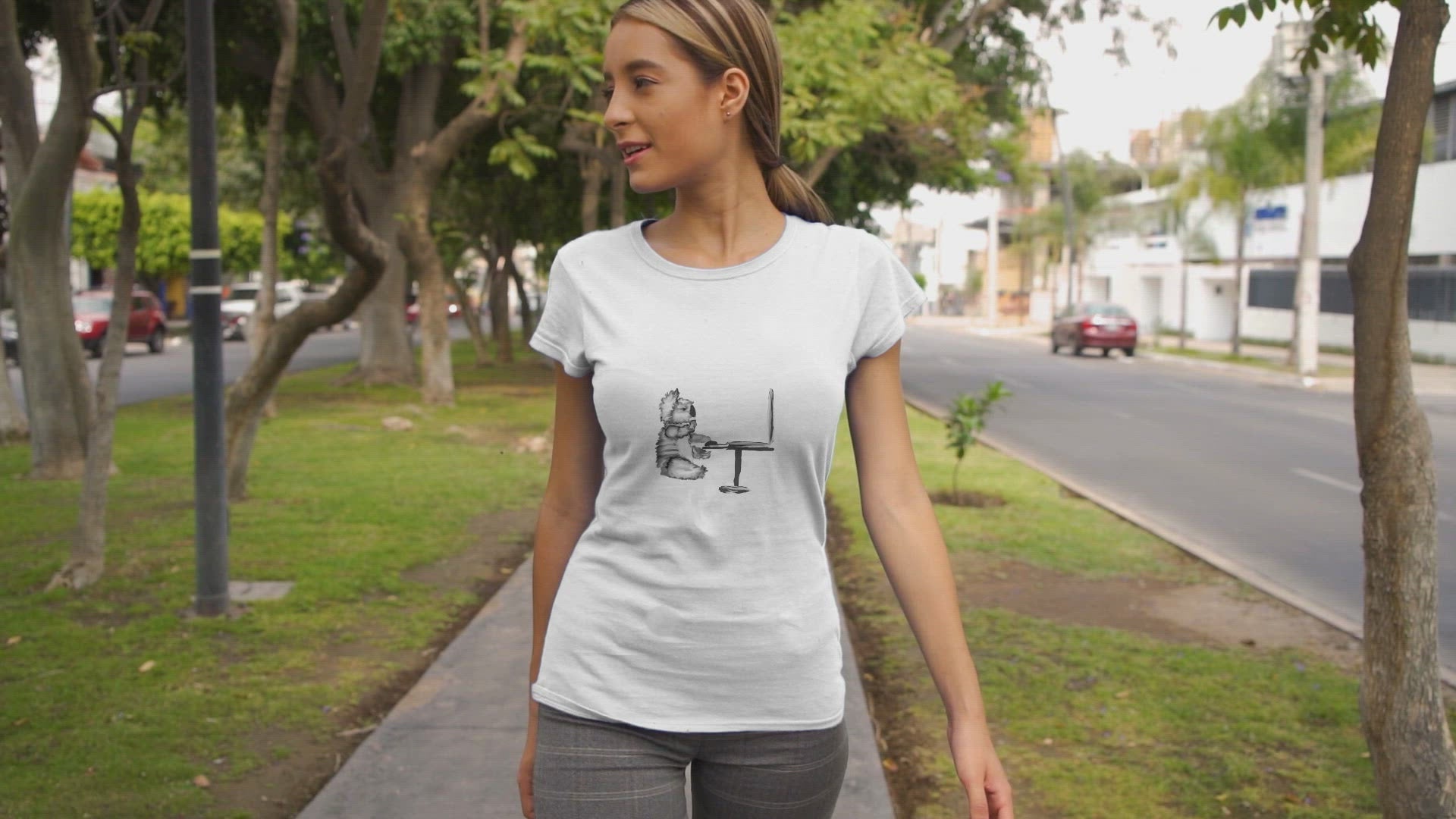 Koala on Computer | Women's 100% Organic Cotton T Shirt worn by a woman walking
