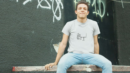 Koala Computer | 100% Organic Cotton T Shirt worn by a man sitting on a ledge