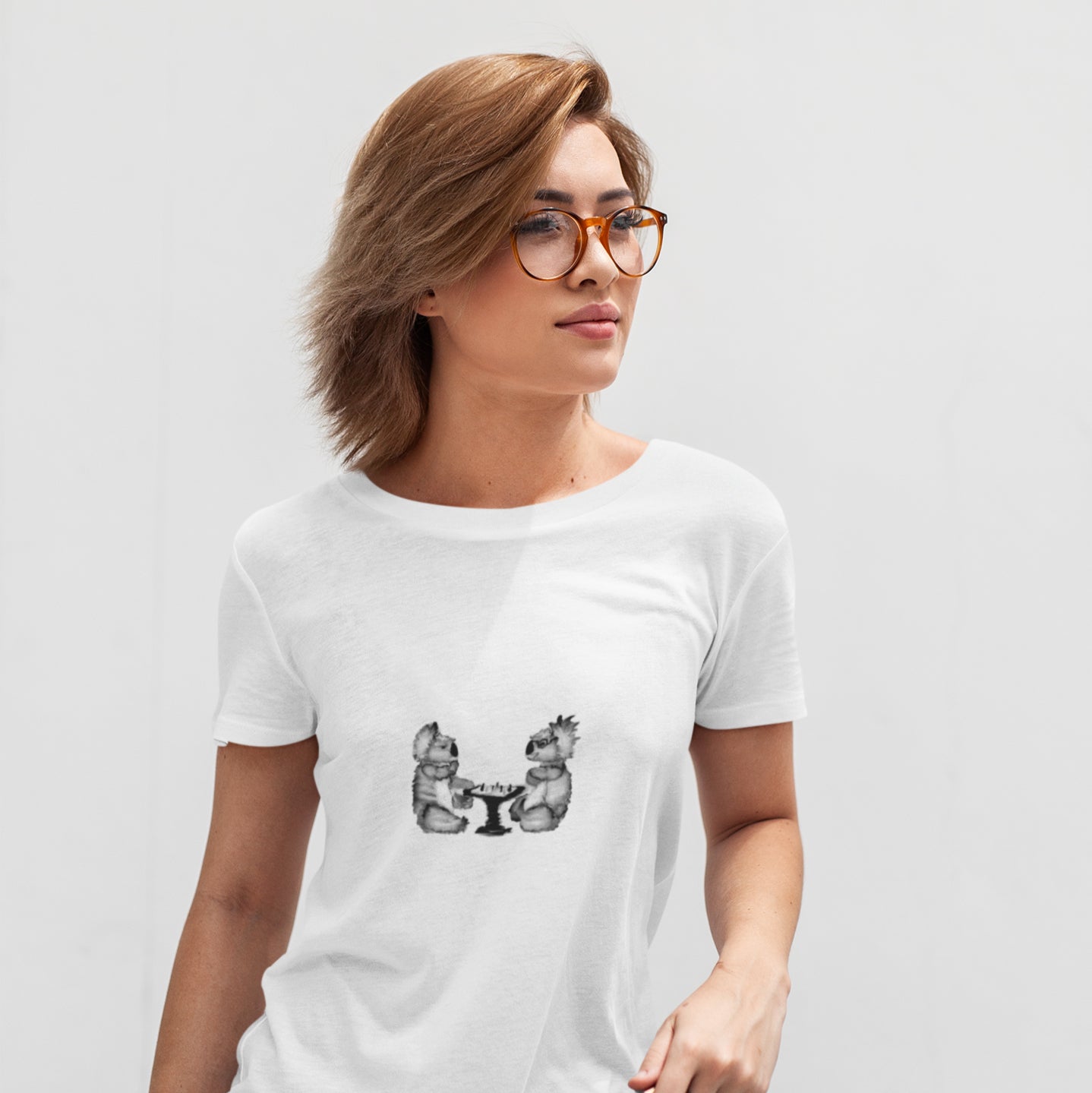 Koalas Playing Chess | 100% Organic Cotton T Shirt worn by a woman
