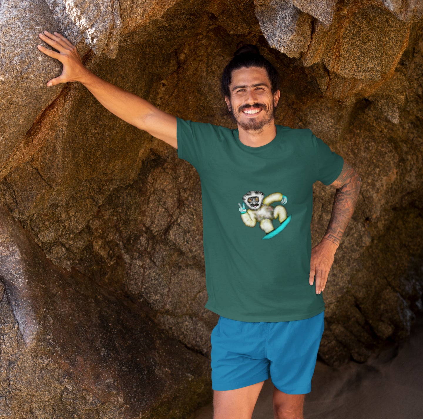 Lemur Snowboarder | 100% Organic Cotton T Shirt worn by a man on the beach