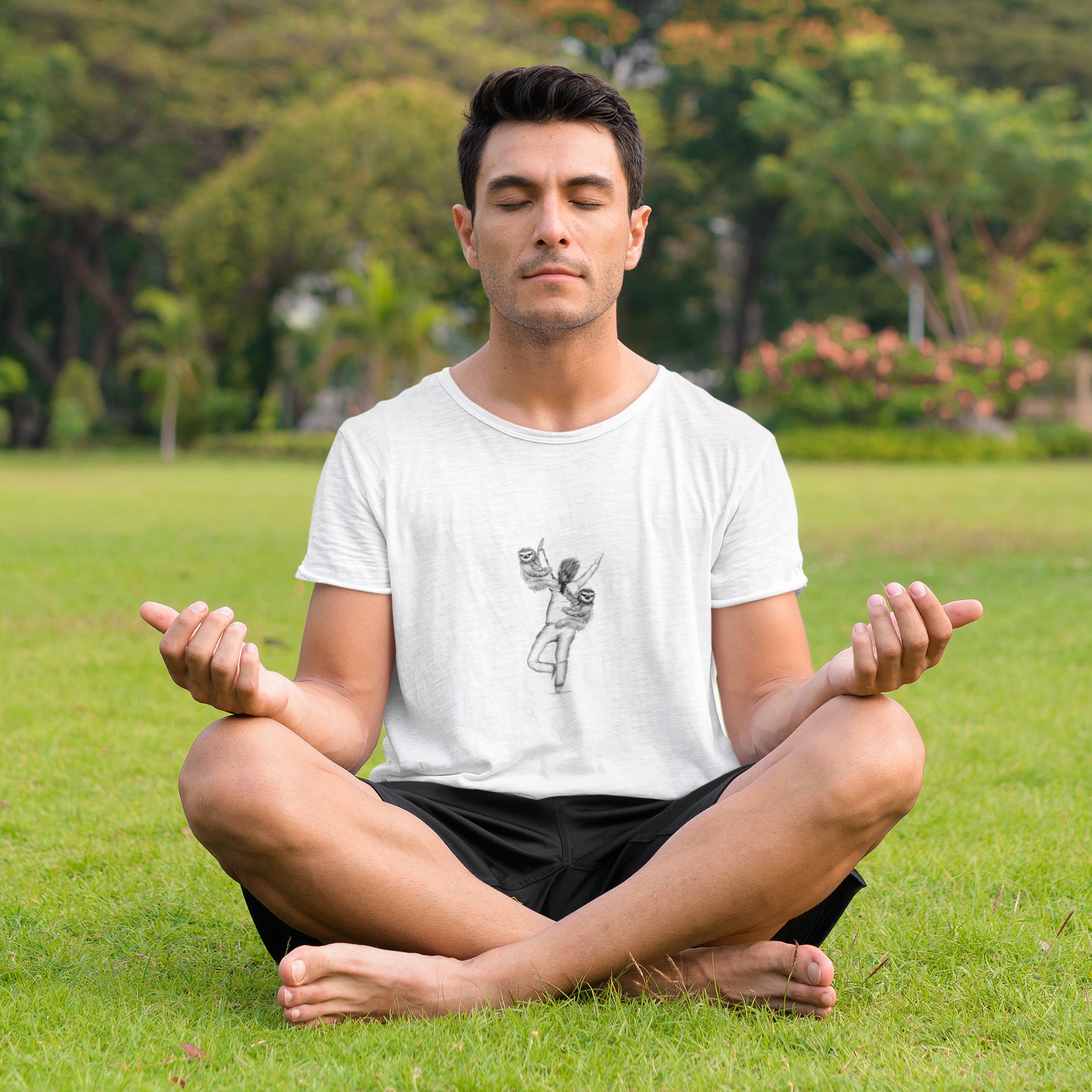 Man in park wearing Yoga sloth tree pose vegan organic cotton t-shirt