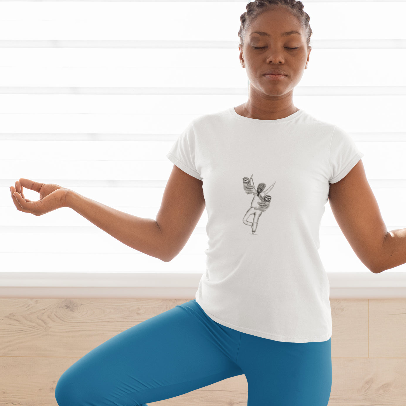 Sloth Yoga | 100% Organic Cotton T Shirt worn by a woman doing a tree pose